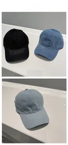 Detailed display of denim baseball caps in black, deep blue and light blue denim fabric