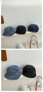 Close-up of three washed denim fisherman hats showing detailed stitching and fabric texture