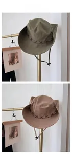 Detail of safari sun hats with cross-stitch brim, windproof drawstring and buckle
