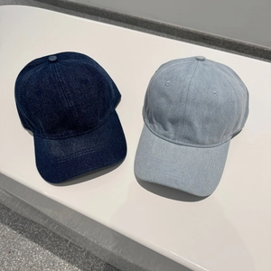 Minimalist denim baseball cap in light and dark blue showing classic six-panel structure