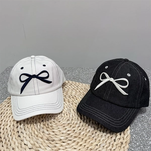 Minimalist embroidered bow baseball cap for women in black and white styles