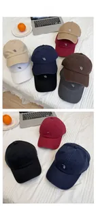 Detail of multi-color cotton canvas baseball caps featuring RH letter embroidery
