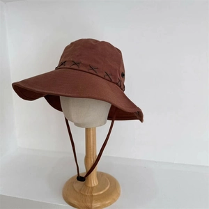 Dark brown wide brim outdoor sun hat with decorative cross-stitching and adjustable chin cord