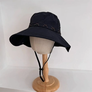 Wide brim black sun hat with adjustable chin strap and cross-stitch detail for hiking