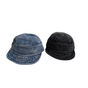 Classic washed denim flat top cap in blue and black colors with reinforced stitching