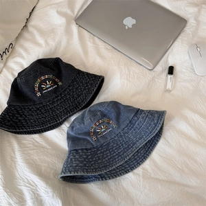 Washed denim bucket hats with Rolling Hearts embroidery and floral sun graphics