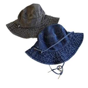 Denim bucket hats in black and navy blue with adjustable drawstrings for sun protection