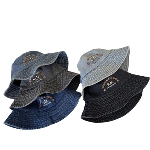 Washed denim bucket hat with Rolling Hearts embroidery in blue, grey and black colors