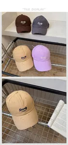 Close-up of four-color baseball caps with vintage distressed holes and letter embroidery
