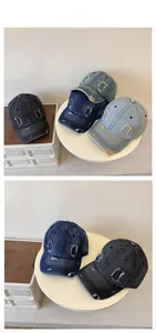 Detailed close-up of distressed denim baseball caps with vintage ripped and frayed texture