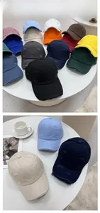 Detail of distressed vintage baseball caps in various colors with frayed hole accents