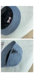 Detail of blue denim bucket hat with internal pink bow and adjustable rear drawstring
