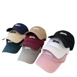 Multiple colors of cotton baseball caps with Consice embroidery in a stacked arrangement