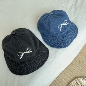 Denim bucket hats with bow embroidery in blue and dark grey, casual sun protection style