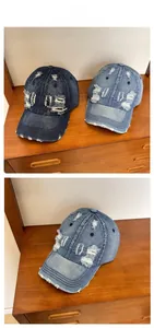 Detail of vintage washed denim baseball caps with distressed ripped edges and retro style
