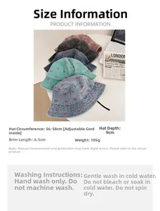 Detail view of denim bucket hats with butterfly embroidery and adjustable sizing labels