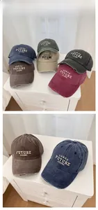 Close-up of vintage washed cotton baseball caps with thick urban letter embroidery details