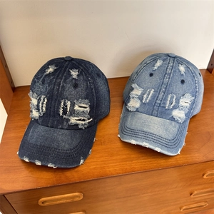 Retro washed denim baseball caps with distressed LOVE letters in blue and light blue