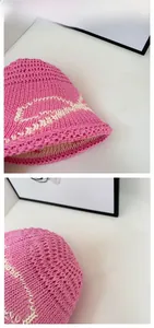 Detail showing the pink woven texture and wave pattern of the knit bucket hat