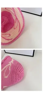 Detailed macro view of pink and white woven texture on a breathable knit bucket hat