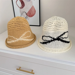 Women's knit sun hat with bow detail and breathable hollow design in khaki and beige
