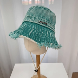 Retro washed denim bucket hat with frayed edges and windproof rope in peacock green
