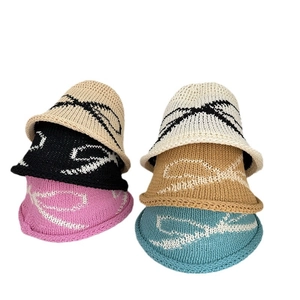 Breathable knitted bucket hat collection for women featuring large bow patterns in six colors