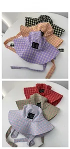 Detail of colorful checkered cotton bucket hats with long adjustable drawstrings