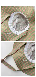 Detail view of plaid sun hat with breathable mesh lining and adjustable windproof cord