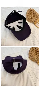 Detail view of cotton baseball cap with Nanbabe embroidery and metal buckle