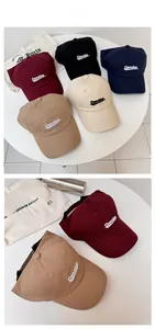 Detail view of five baseball caps in various colors with high-quality Concise embroidery
