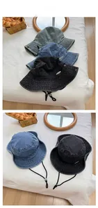 Detail of vintage denim bucket hats with frayed edges and adjustable windproof straps