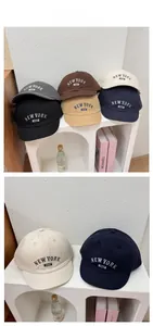 Detail showing various colors of embroidered soft top baseball caps with vintage letters