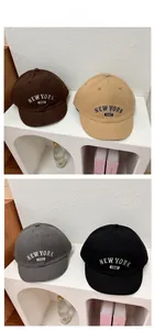Detail display of vintage short brim baseball caps with New York 1987 embroidery in four colors