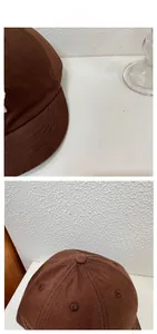 Detail view of dark brown cotton baseball cap showing white 3D letter embroidery and fabric