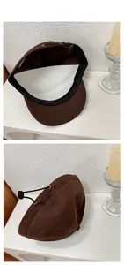Internal details of brown cotton baseball cap showing black sweatband and adjustable cord