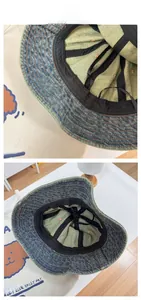 Detail view of denim bucket hat interior with sweatband and reinforced stitching
