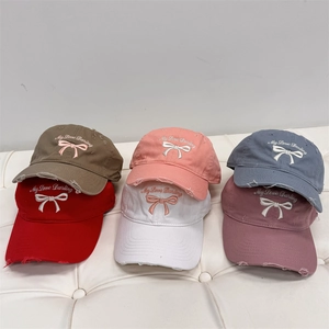 Set of six vintage washed cotton baseball caps with embroidered bow and sweet design