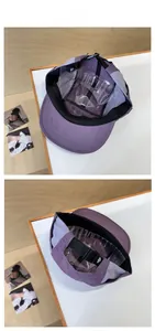 Detail of purple quick-dry cap showing breathable mesh and adjustable buckle strap