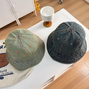 Vintage denim bucket hats in green and indigo with contrast stitching and air holes