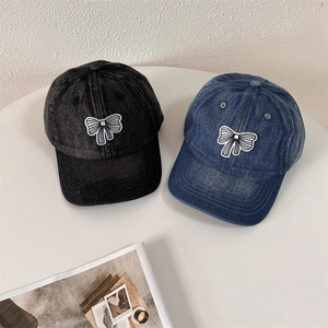 Washed denim baseball caps with bow embroidery in black and denim blue colors