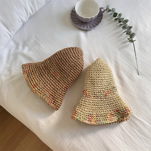 Handwoven straw sun hat with wide rainbow brim in coffee and beige colors for summer beach