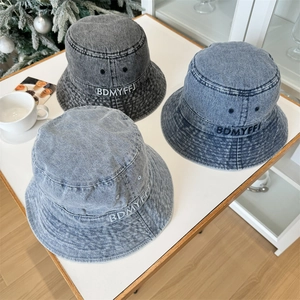 Three-pack washed denim bucket hats with letter embroidery in black and blue tones