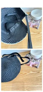 Detail of black crochet bag showing intricate hollow patterns and white lace trim edge