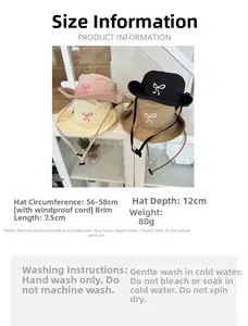 Detail of cute sun hat with bow embroidery and adjustable windproof chin strap