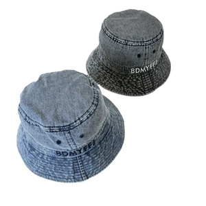 Vintage washed denim bucket hats with letter embroidery in light and dark blue shades