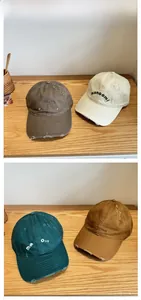 Detailed tile display of washed cotton baseball caps with vintage distressed embroidery