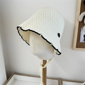 Lace hollow breathable straw fisherman hat for women with black trim and chin strap