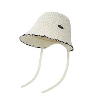 Breathable beige crochet straw bucket hat with black lace trim and ties for women