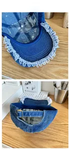Detail of blue denim baseball cap with white lace trim and adjustable metal back buckle